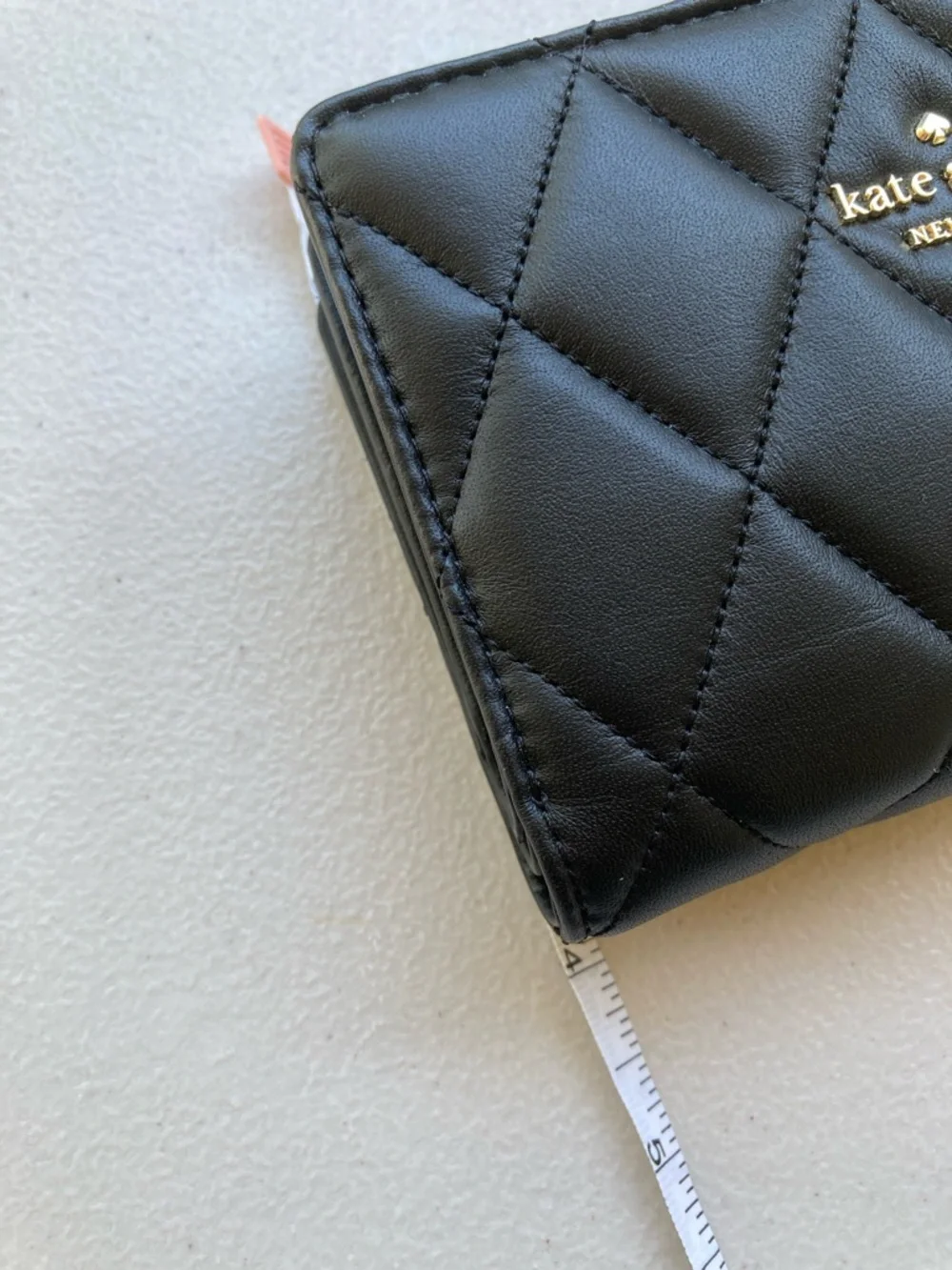 Kate Spade New York Carey Medium Compact Bifold Wallet in Black Quilted Leather